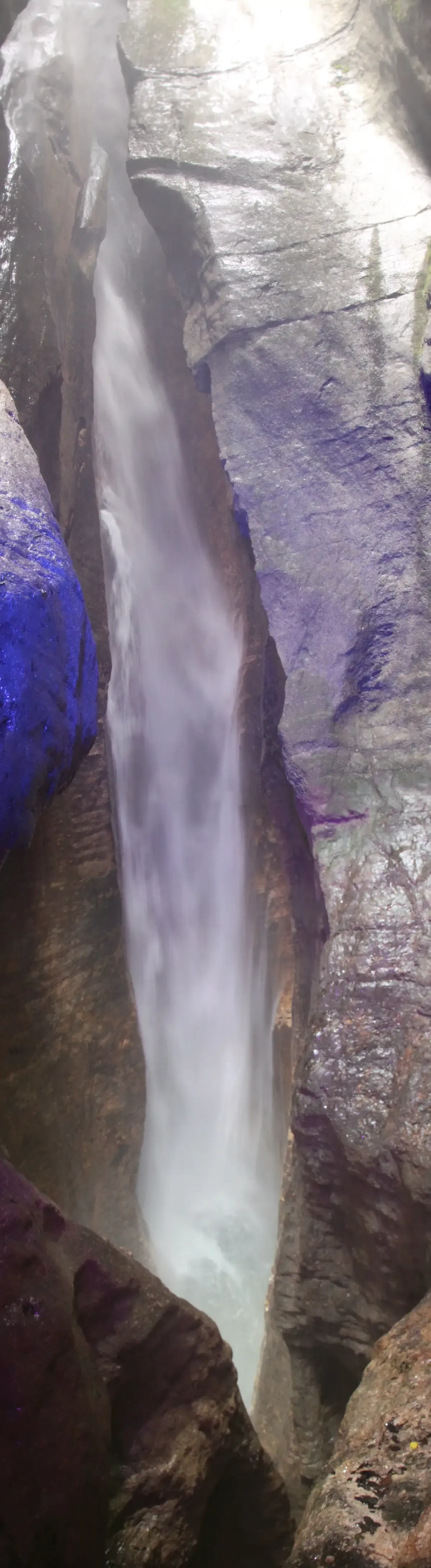 The Cascata del Varone waterfall falling through a narrow rock gorge near Riva del Garda